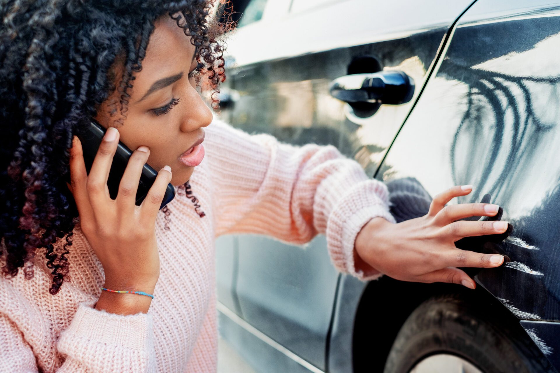 Woman feeling sad after scratching her auto auto insurance
